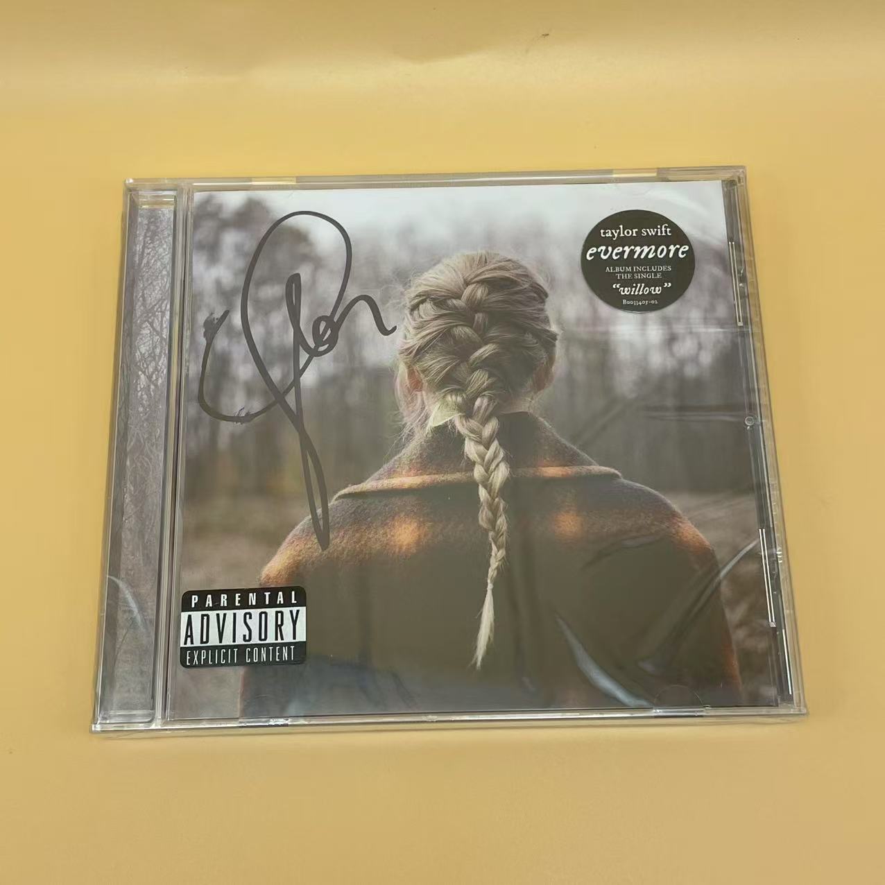 Taylor Swift - Rare Signed Evermore Album with Elegant Personal Signature