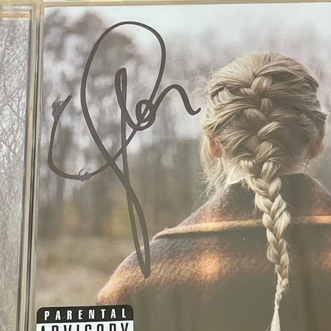 Taylor Swift - Rare Signed Evermore Album with Elegant Personal Signature