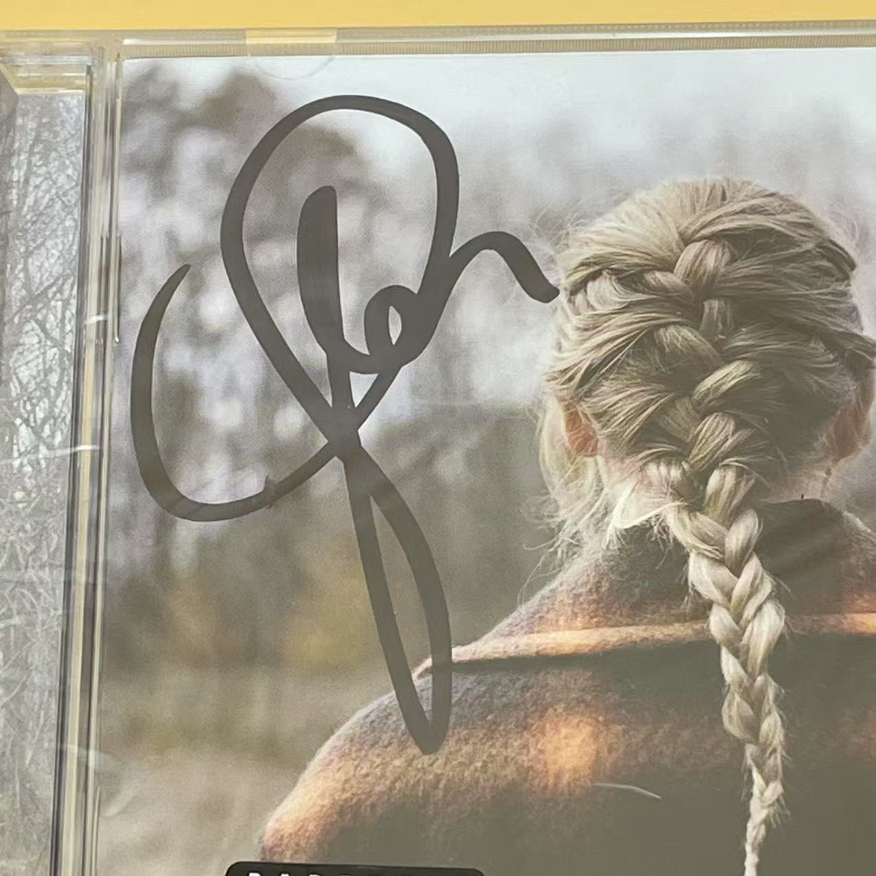 Taylor Swift - Unique Signed Evermore Album with Iconic Touch