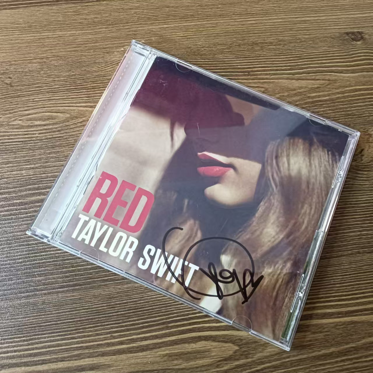 Taylor Swift Red autographed CD. Both CDs are in excellent condition.